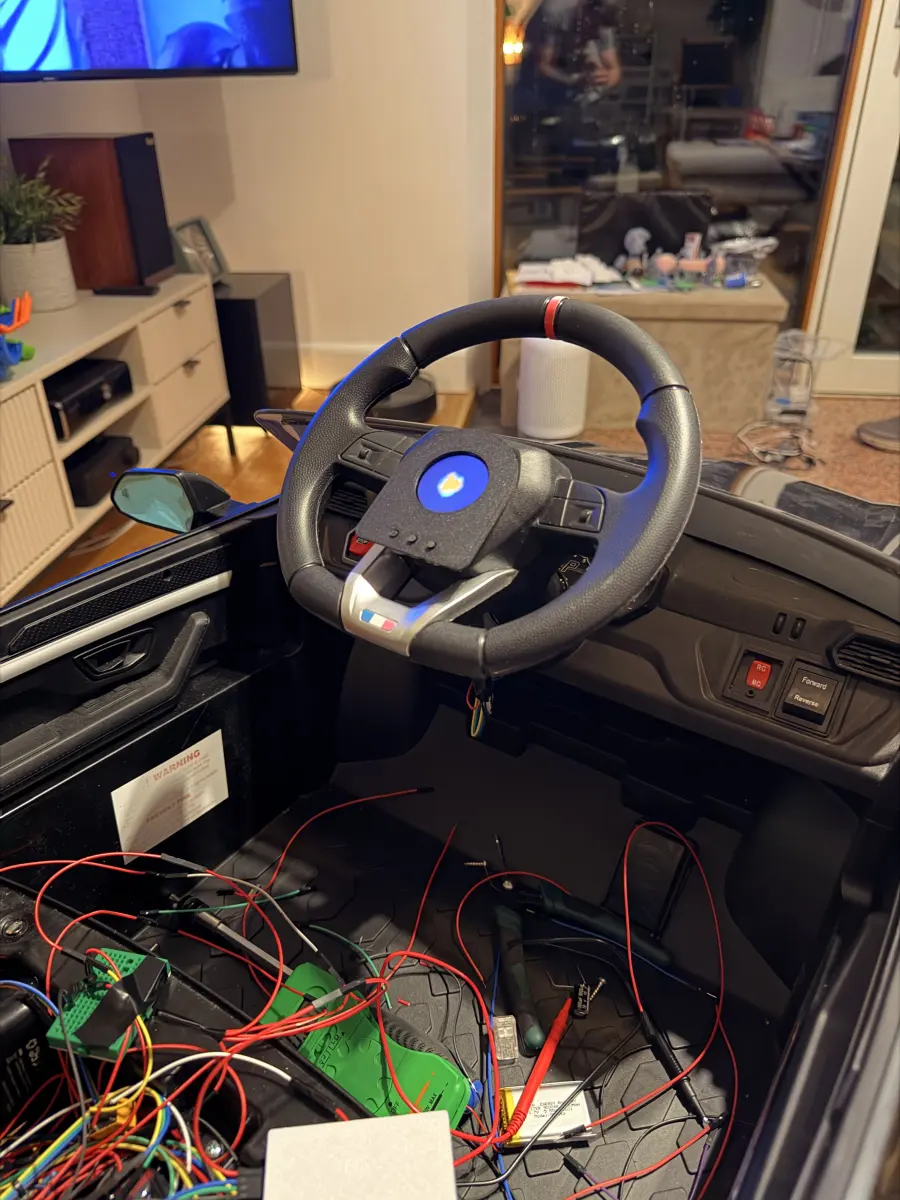 The cockpit mid-build, with a breadboard and jumper wiring in the footwell